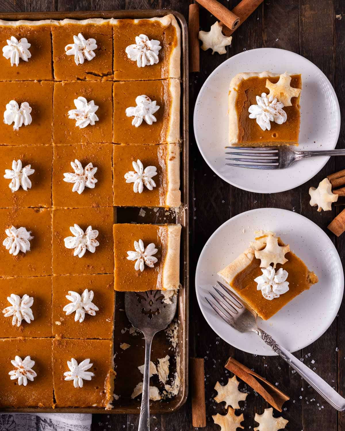 overhead view of sheet pan pumpkin pie, two pieces on plates