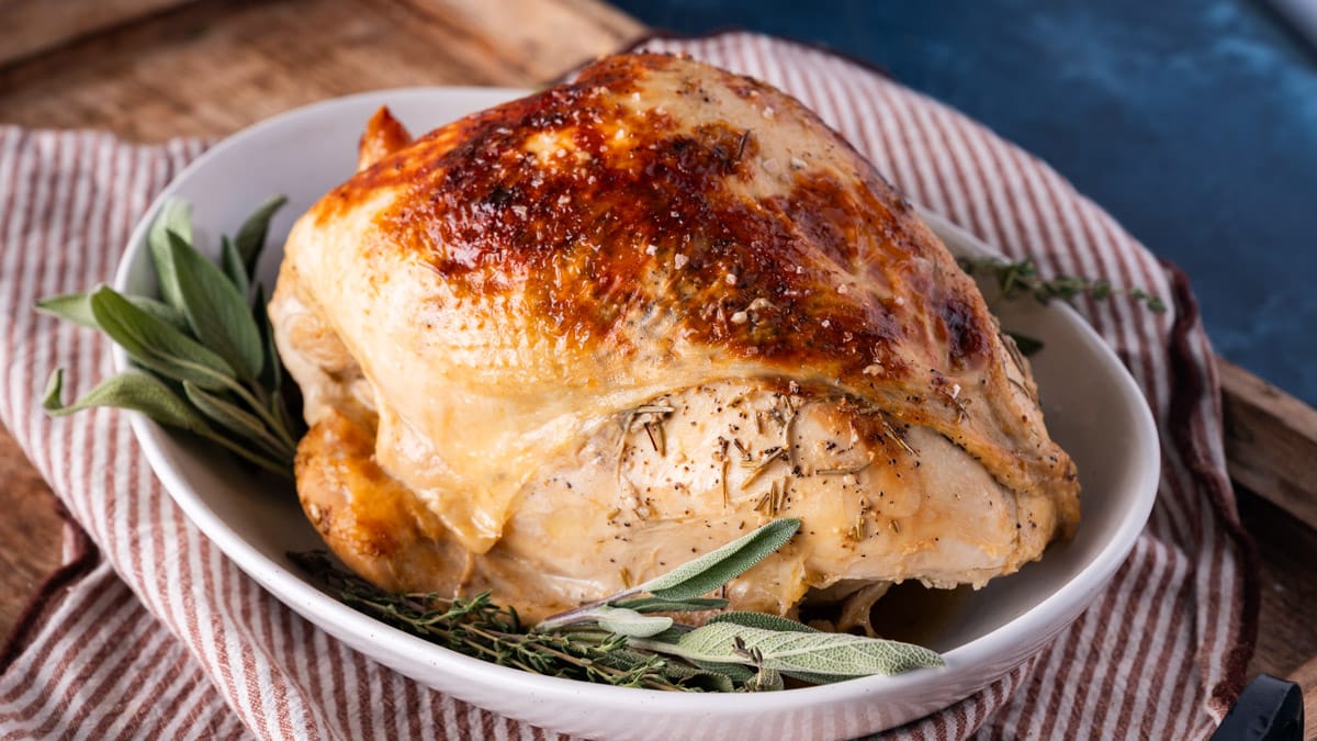 a turkey breast cooked in a slow cooker on a plate