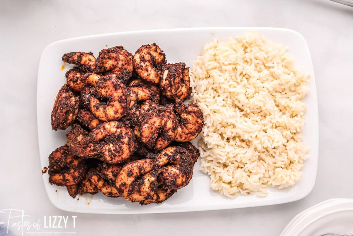 a plate with rice and smoked shrimp