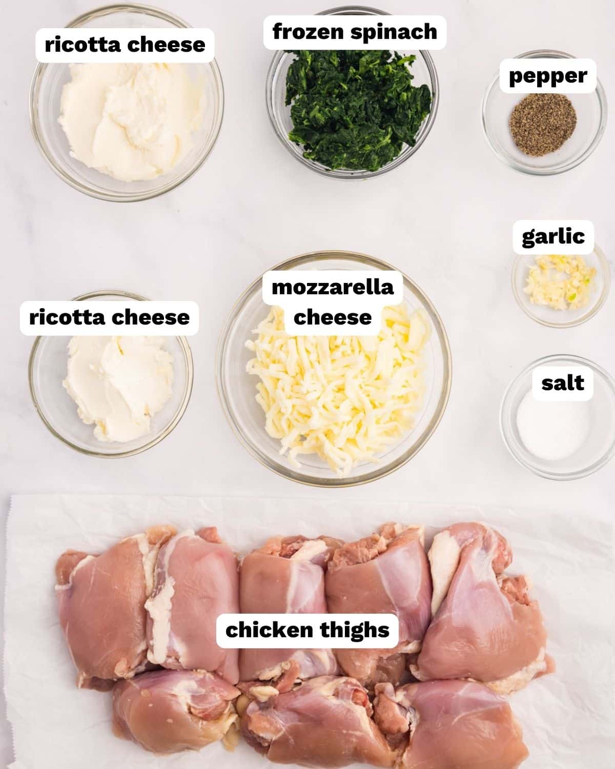 ingredients for stuffed chicken thighs on a table