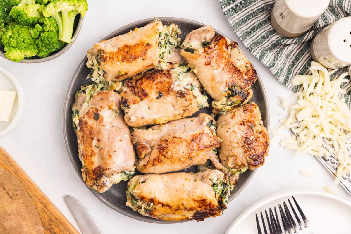 a plate of stuffed chicken thighs on a table