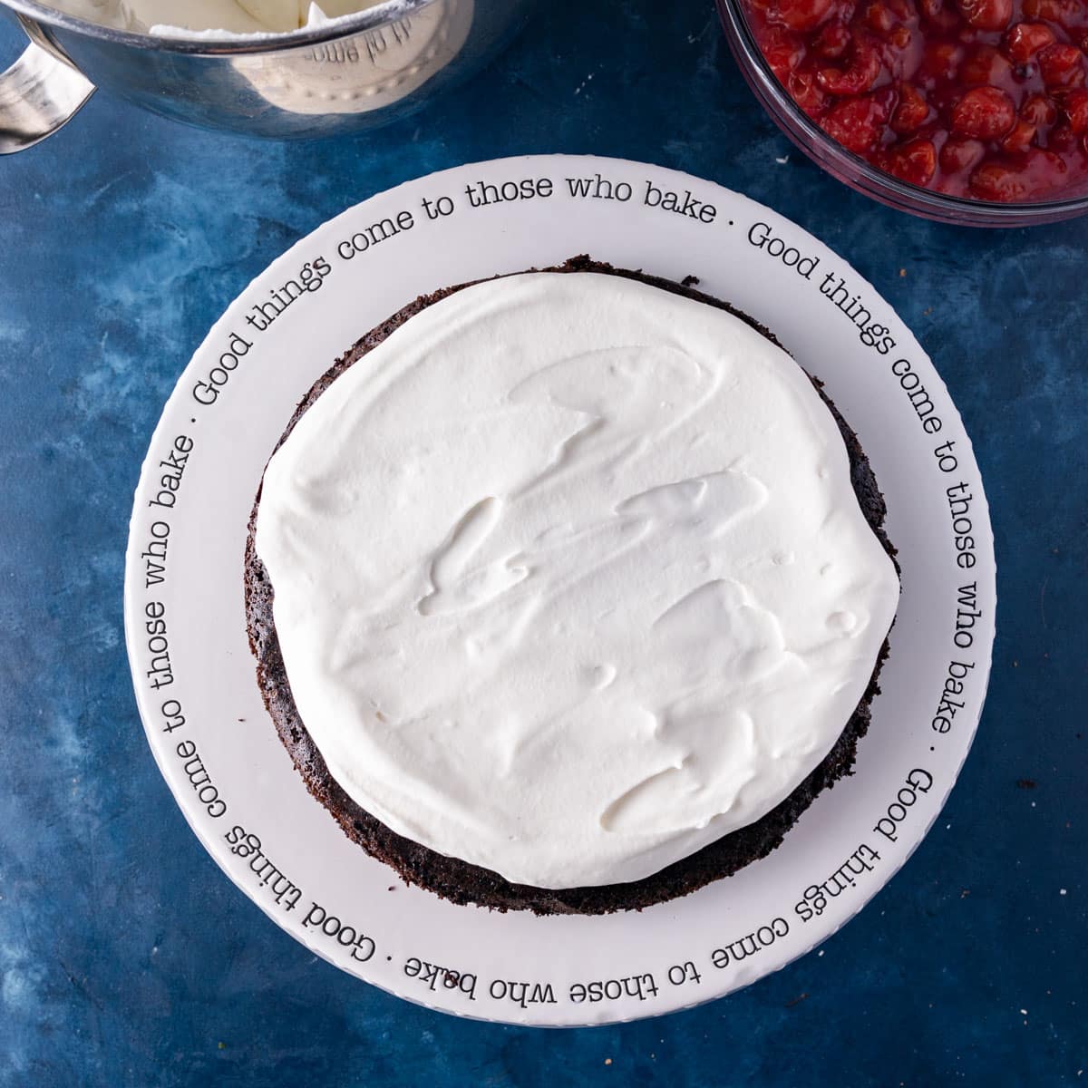 a cake layer frosted with whipped cream