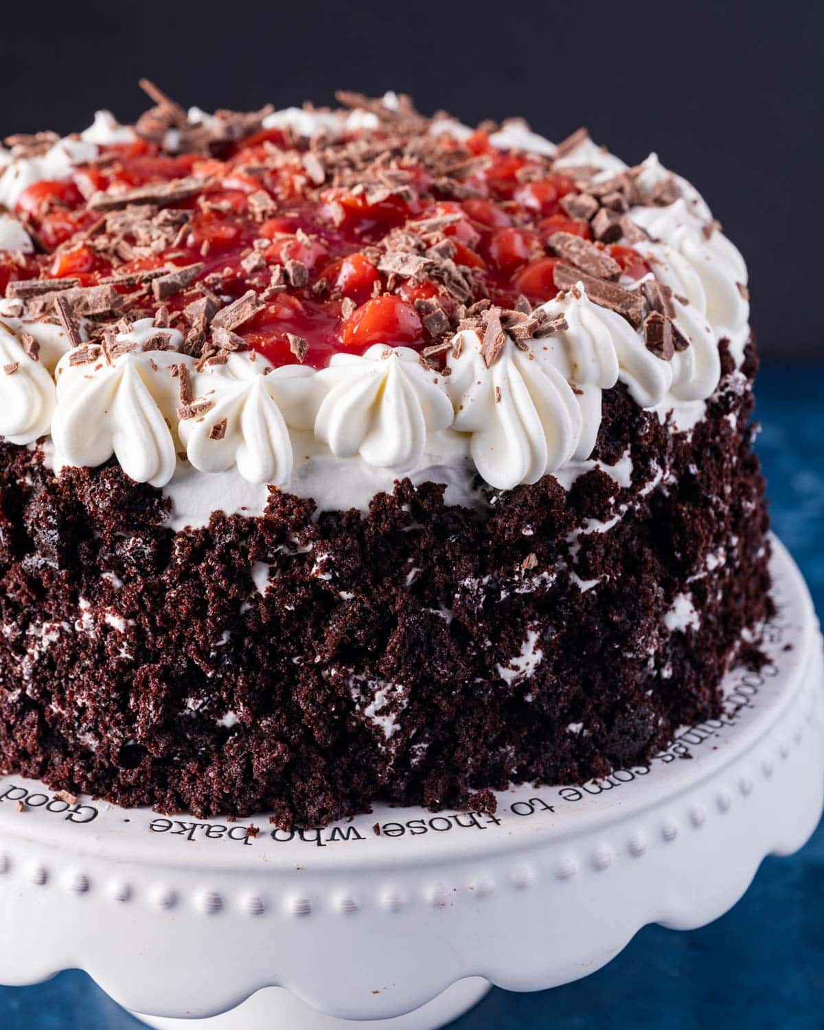 a black forest cake coated in cake crumbs on a table