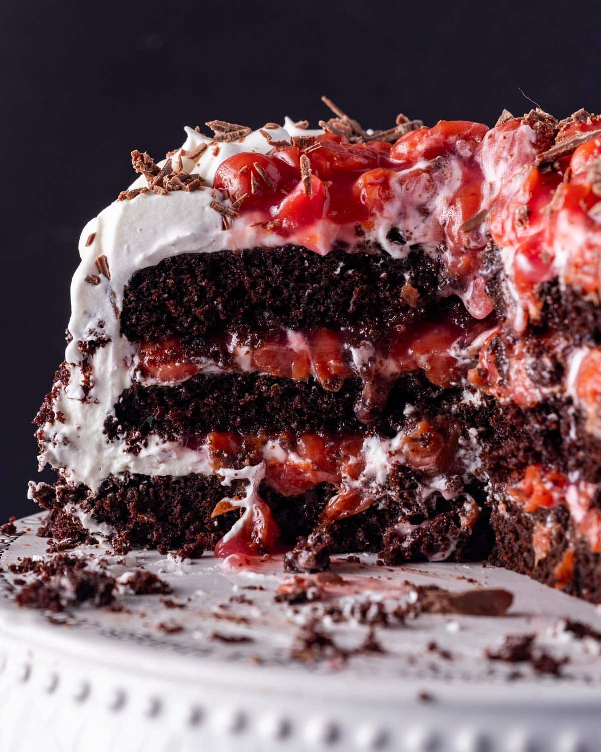 the inside of a black forest cake with cherries