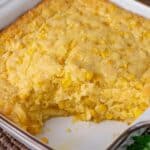 easy corn casserole in a baking dish with one scoop out