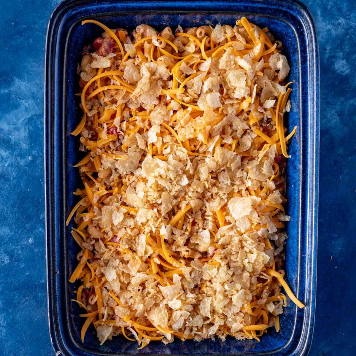 crushed potato chips and cheese in a casserole