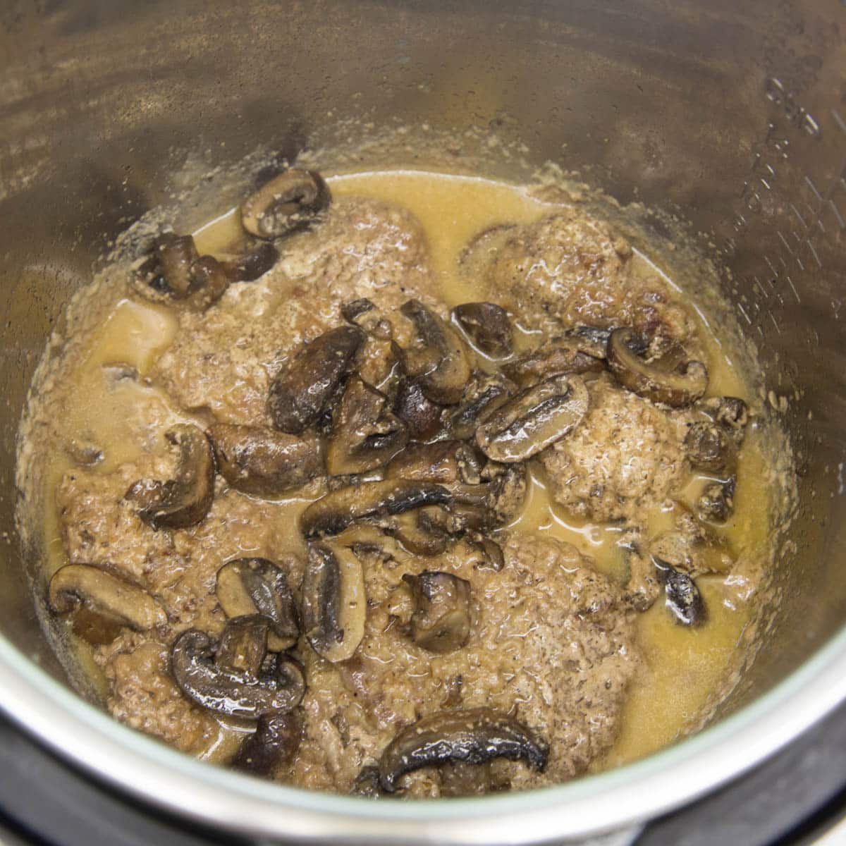 mushrooms and cube steak in an instant pot