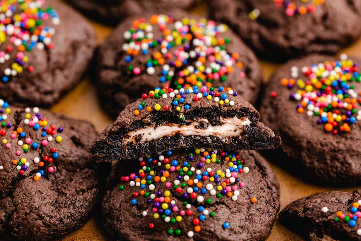 peppermint patty cookies on a baking sheet, one cut in half