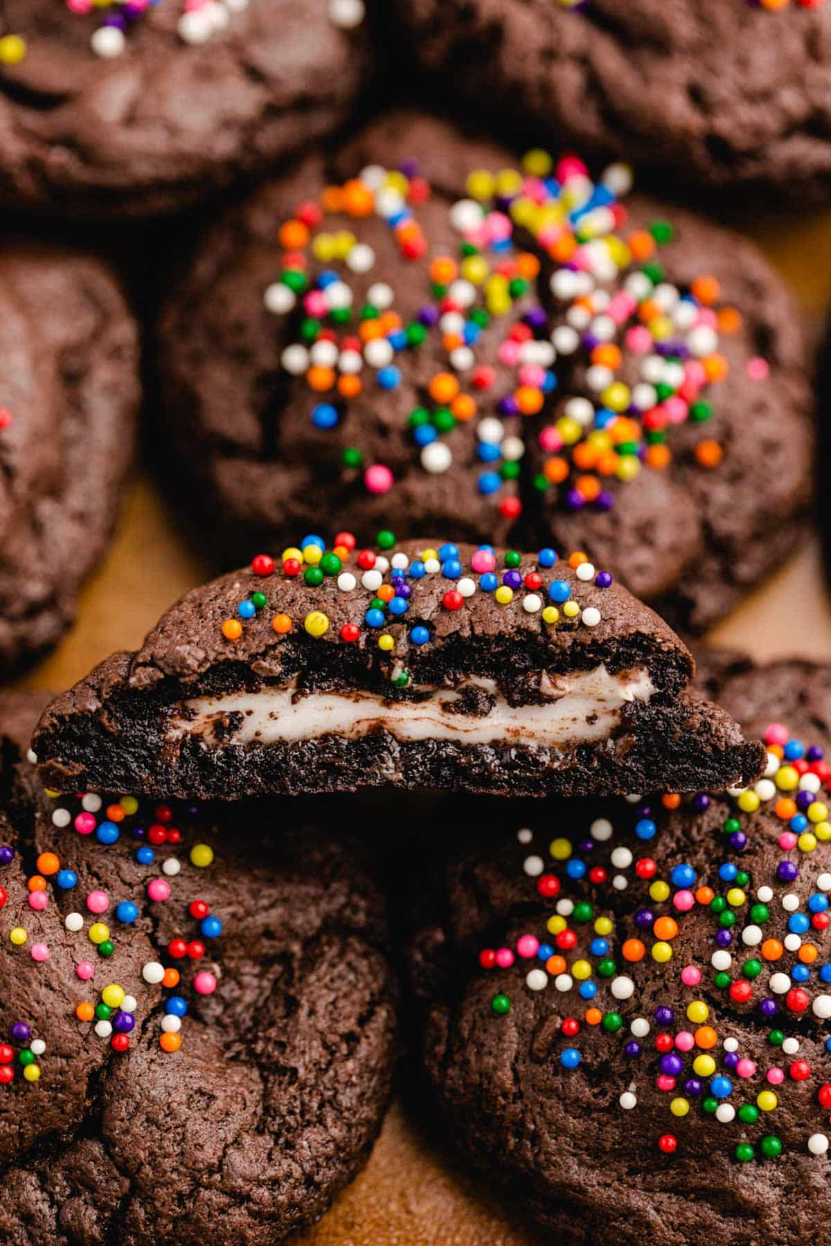 peppermint patty cookies on a baking sheet, one cut in half