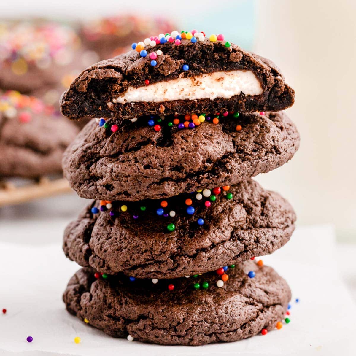 a stack of 4 peppermint patty stuffed cookies, one cut in half