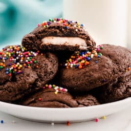 a plate of chocolate cookies with peppermint patties inside