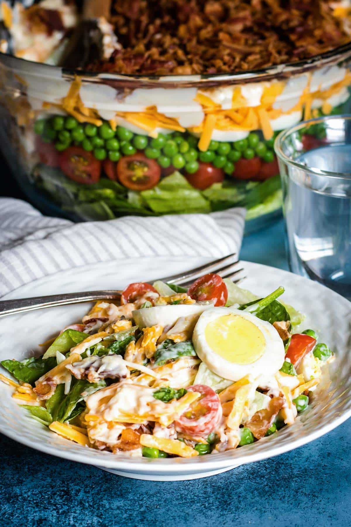 seven layer salad in a bowl on a table