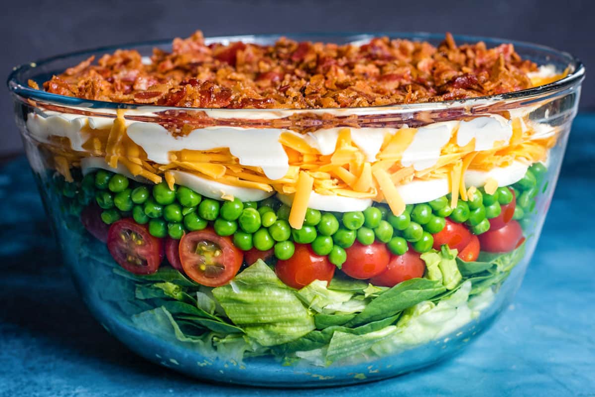 closeup of 7 layer salad in a bowl