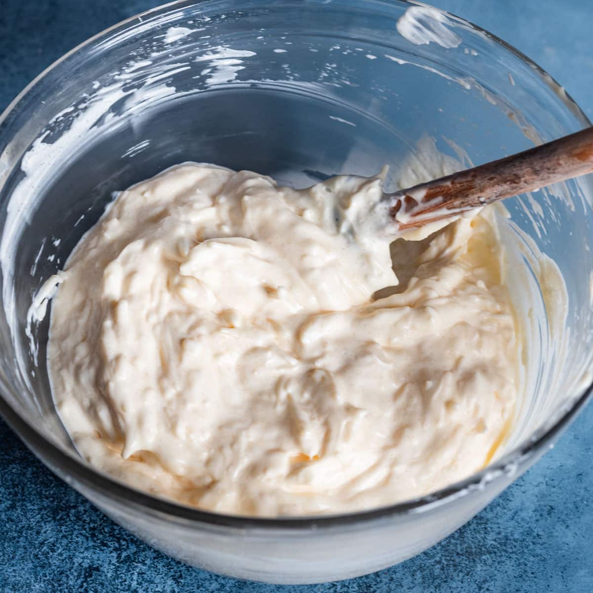 mayo sauce in a mixing bowl with a spatula