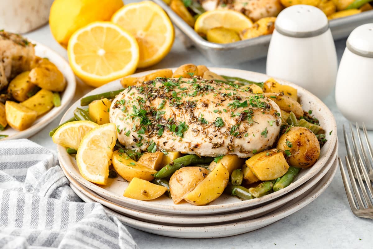 lemon chicken, potatoes and green beans on a plate