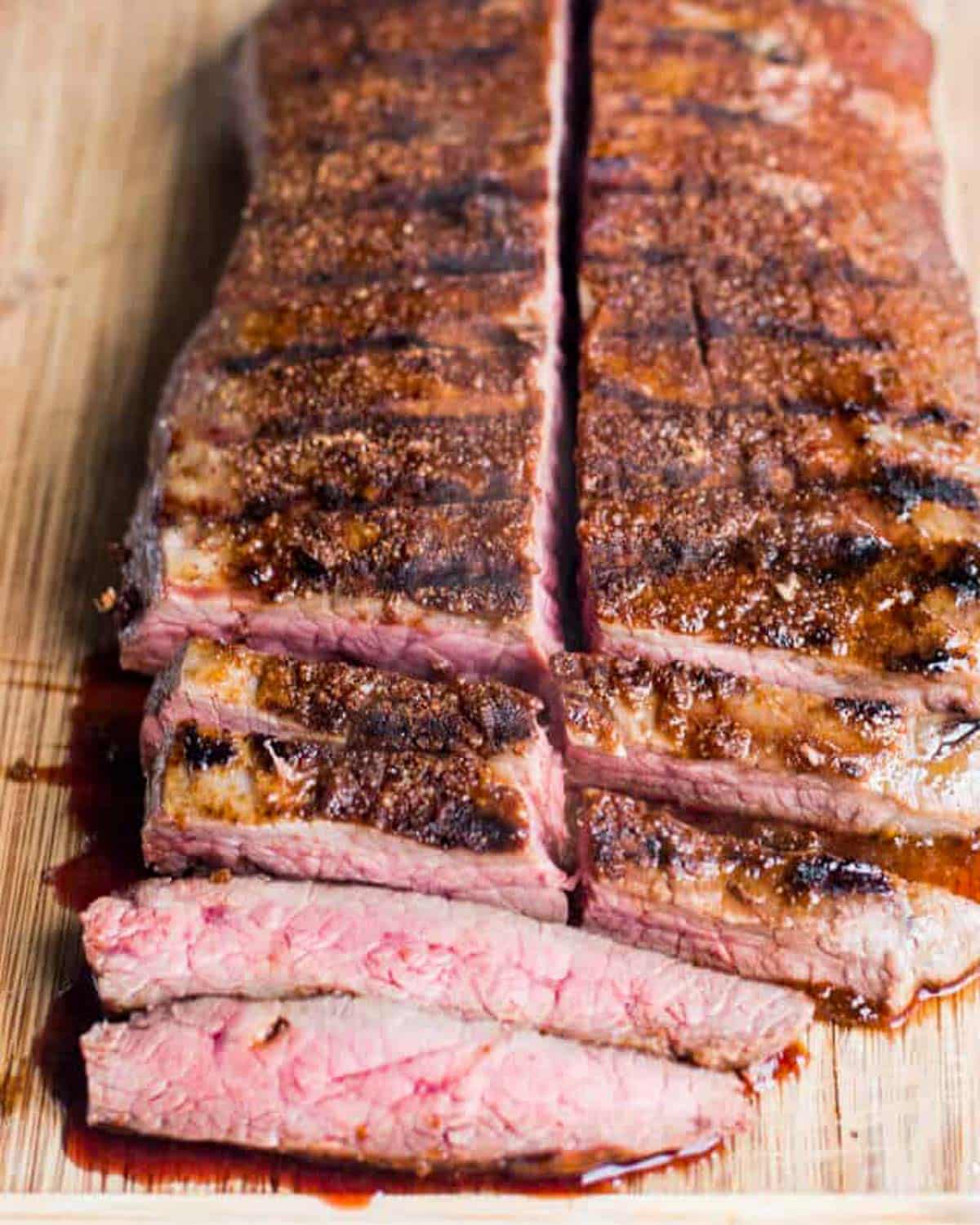 cooked fajita flank steak on a cutting board