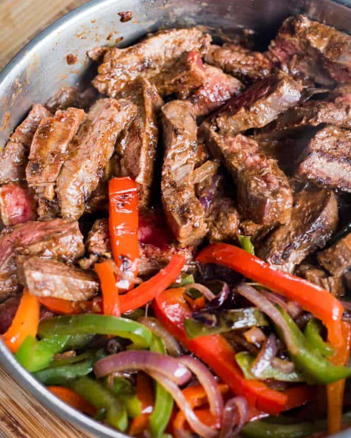 closeup of steak fajitas in a skillet