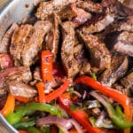 closeup of steak fajitas in a skillet