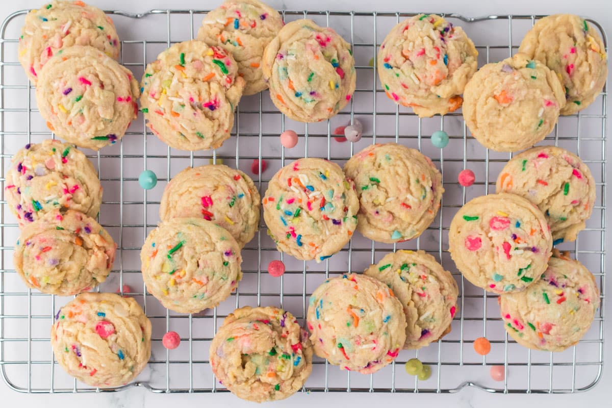 rainbow chip birthday cookies on a wire rack