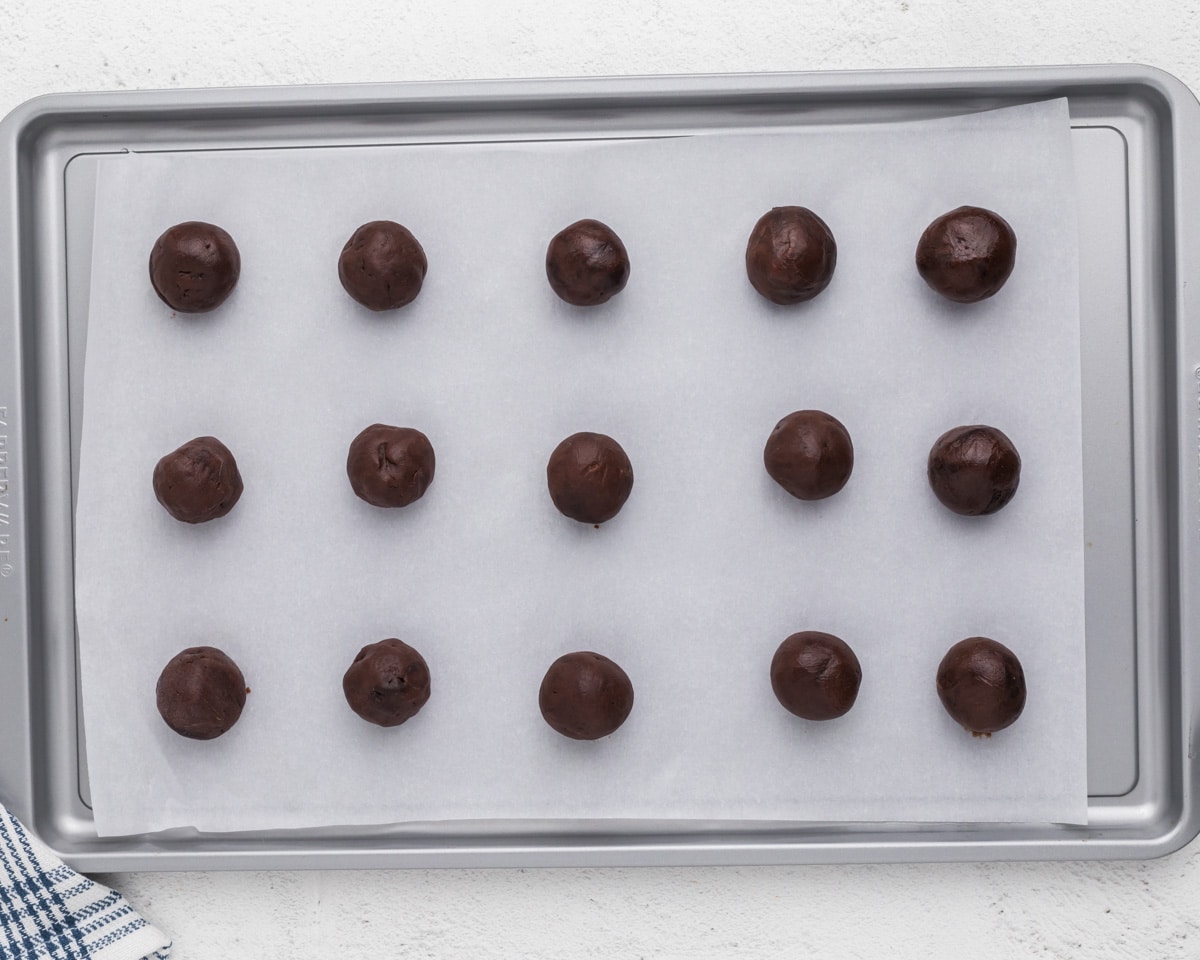 brownie batter balls on a baking sheet