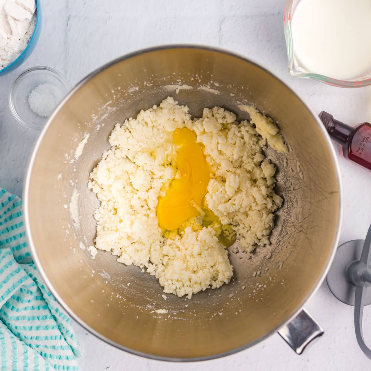 egg over creamed butter and sugar in a bowl