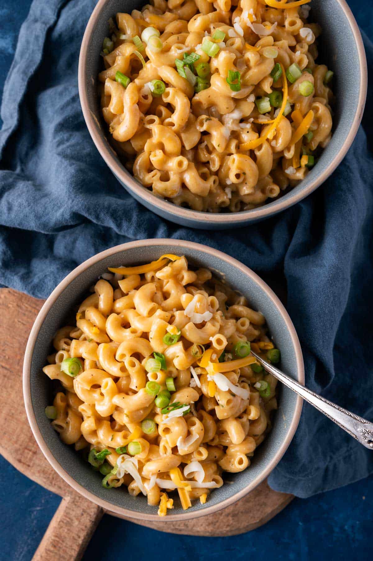 two bowls of mac and cheese on a table