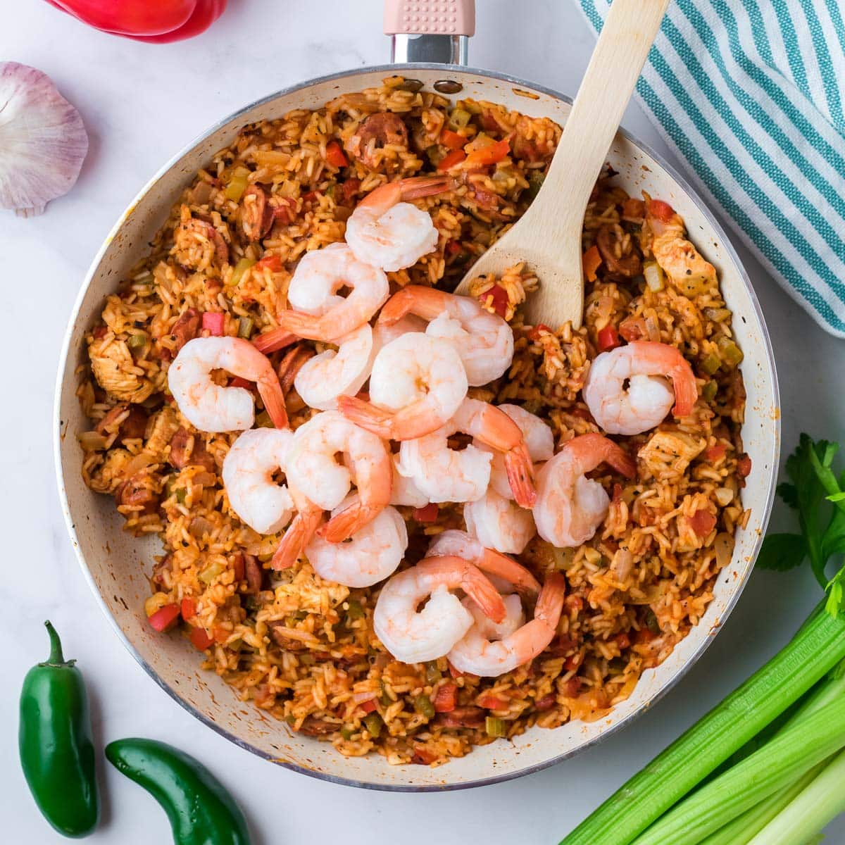 shrimp over rice in a pan