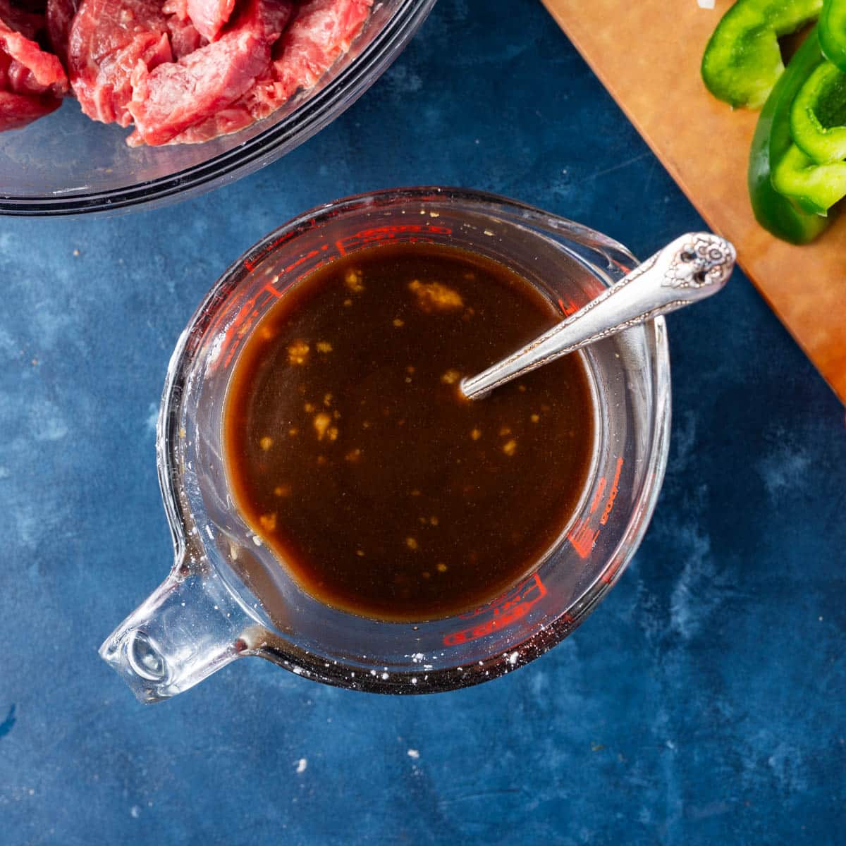 sauce for pepper steak in a glass cup