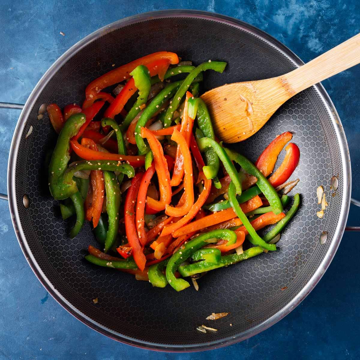 veggies sautéing in a frying pan