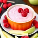 raspberry mascarpone dip in a bowl with raspberries on top