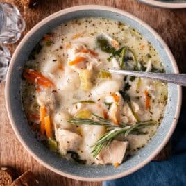 a bowl of chicken gnocchi soup with a spoon