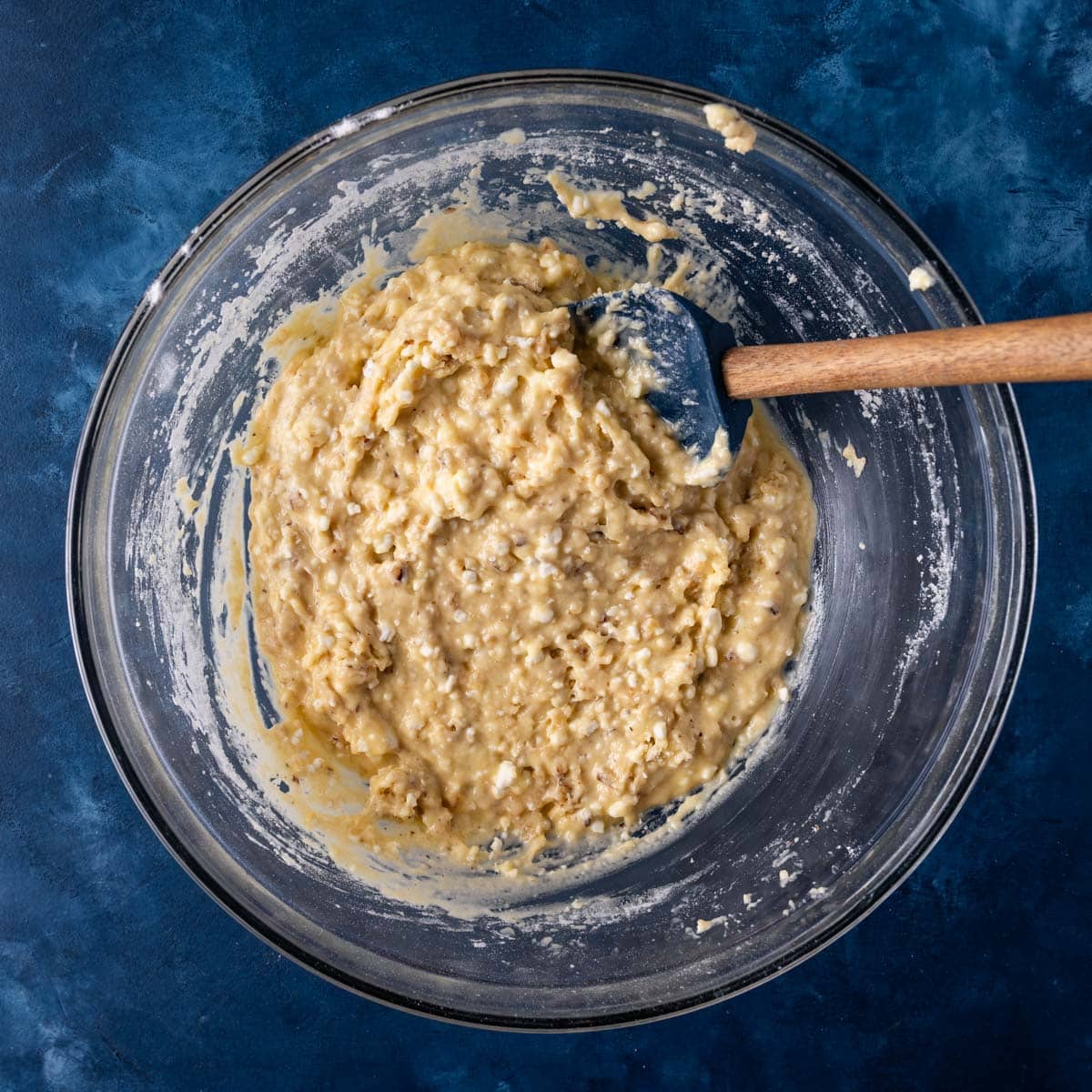 cottage cheese bread batter in a glass bowl