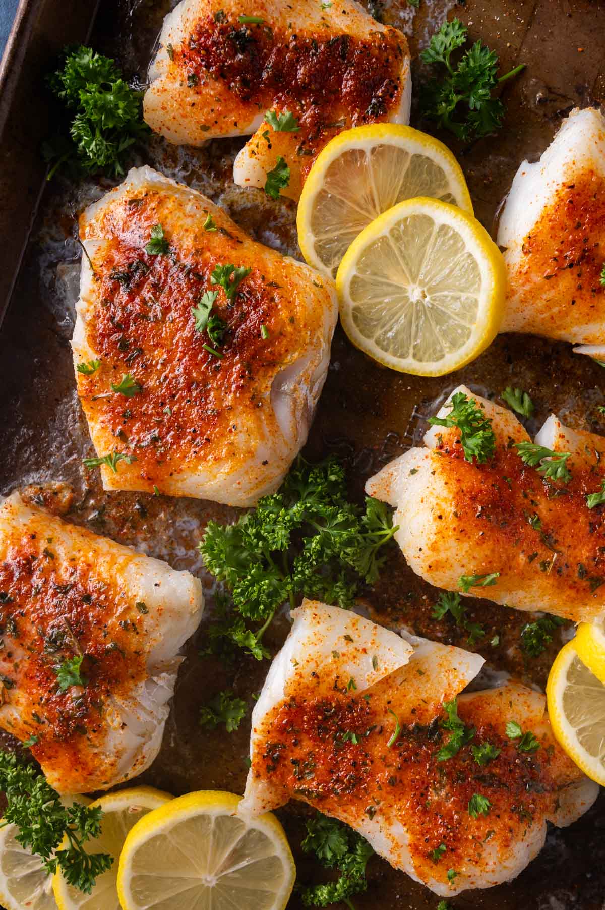 baked cod on a baking sheet