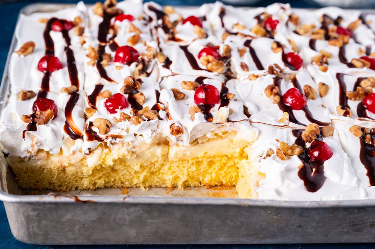 the inside of a layered yellow cake with bananas and pudding