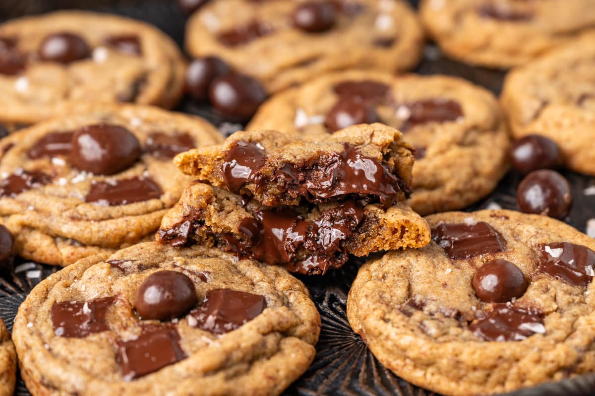 mocha chocolate chip cookie cut in half with melty chocolate chips