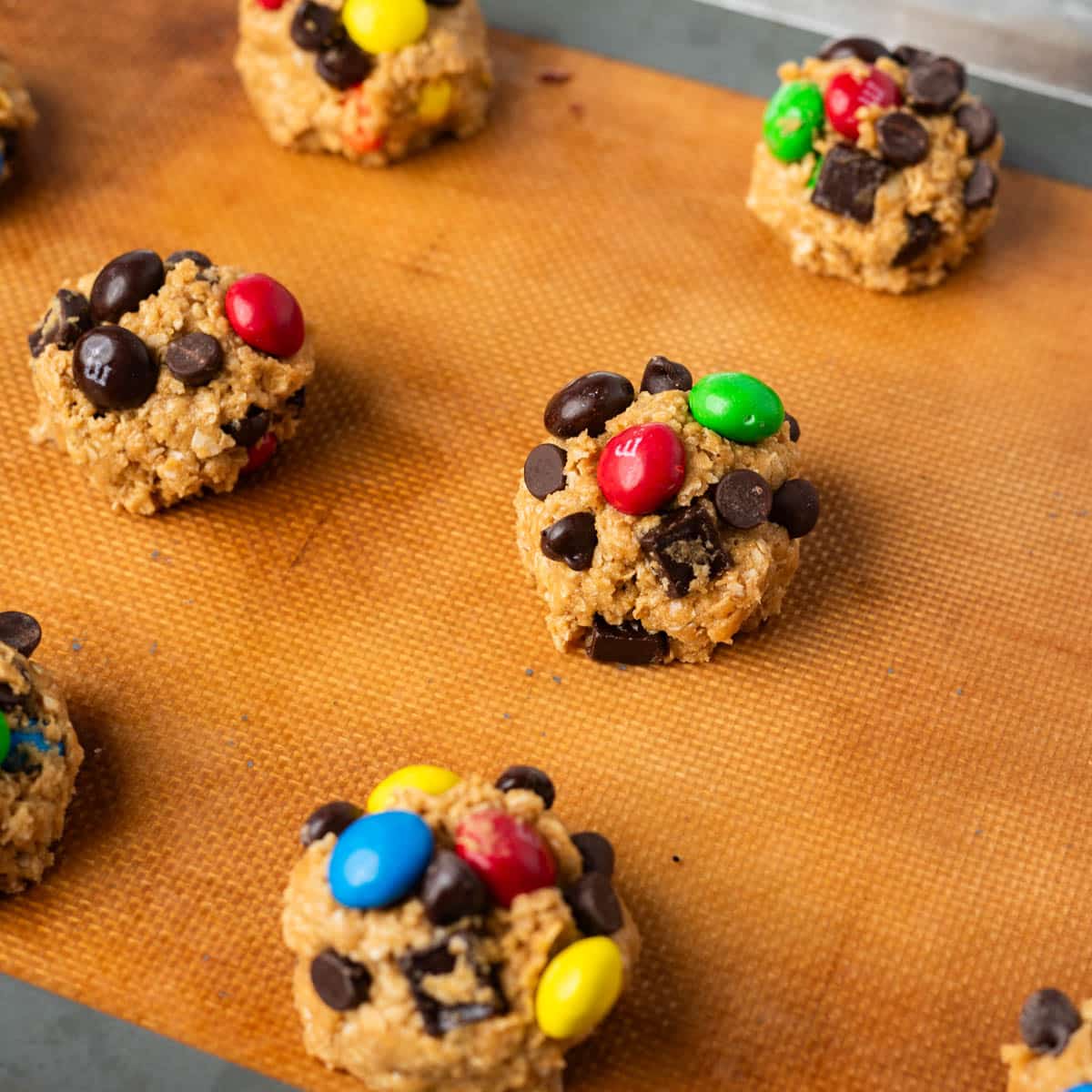 cookie dough balls on a baking sheet