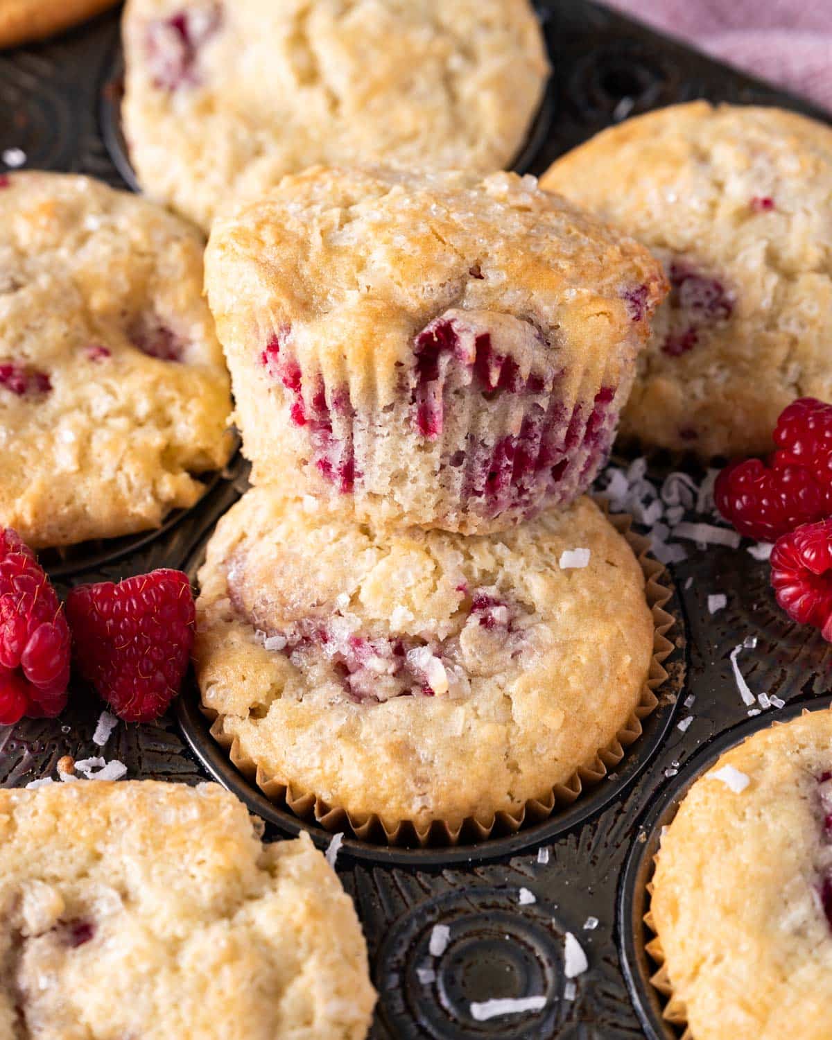 raspberry coconut muffins in a pan