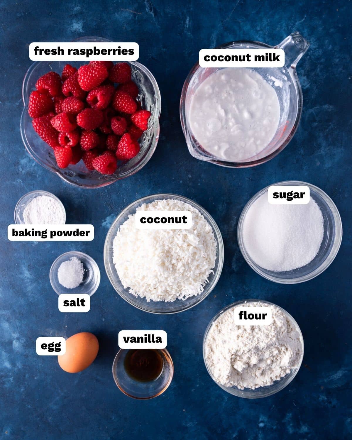 ingredients for raspberry coconut muffins on a table