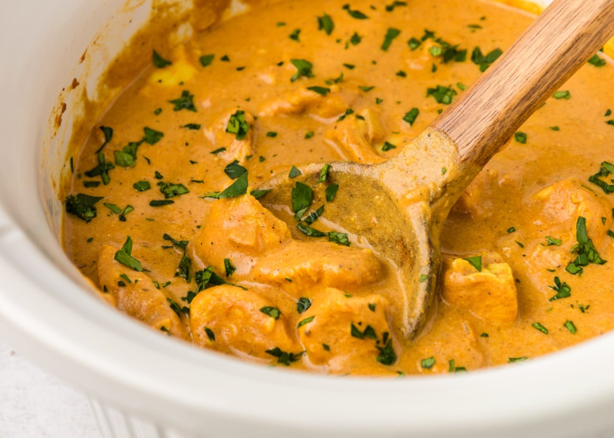 closeup of butter chicken in a slow cooker