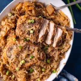 fork tender pork chops and sauerkraut on a plate