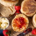 english muffins on a table with butter and jam