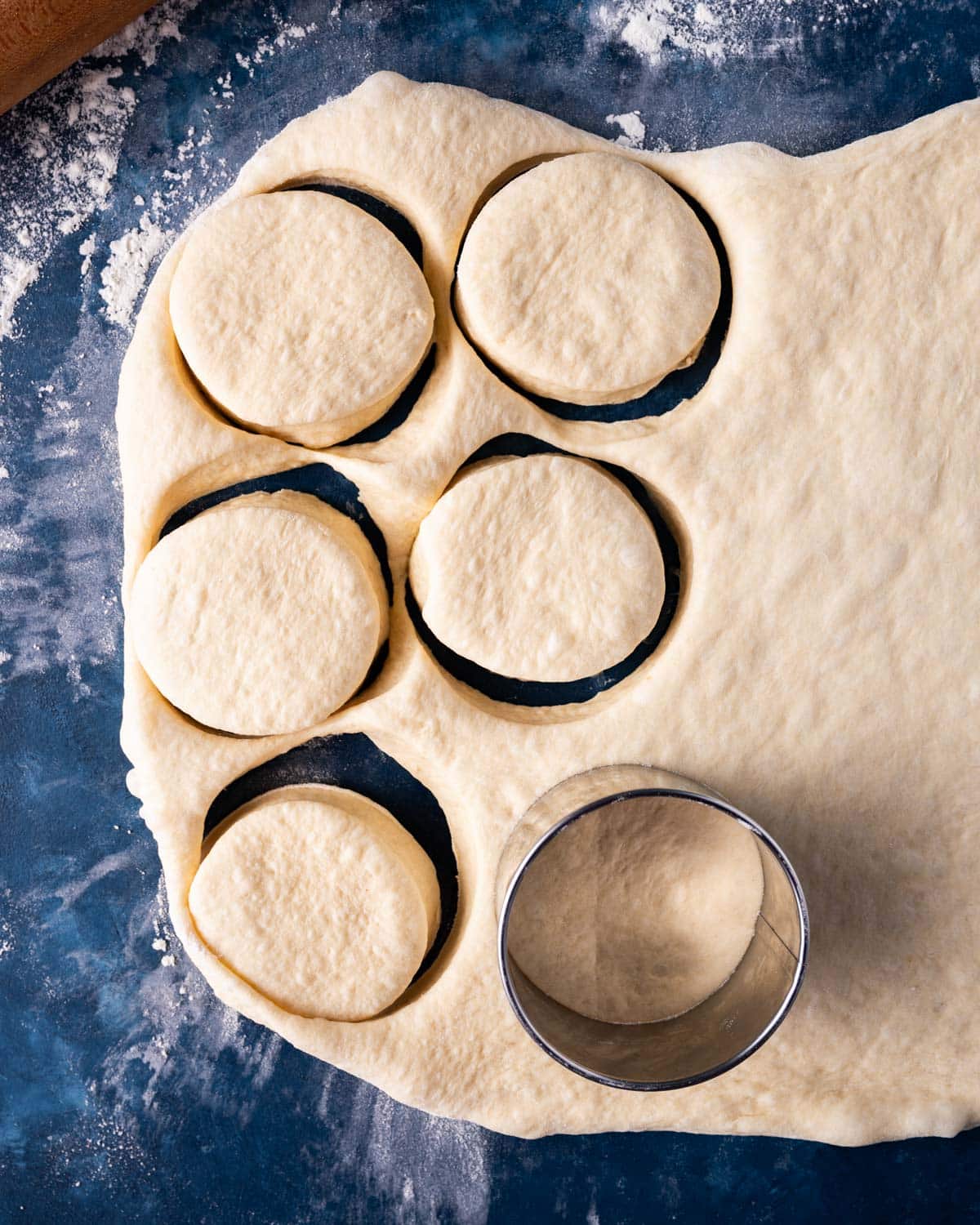 dough on a table with 3" circles cut