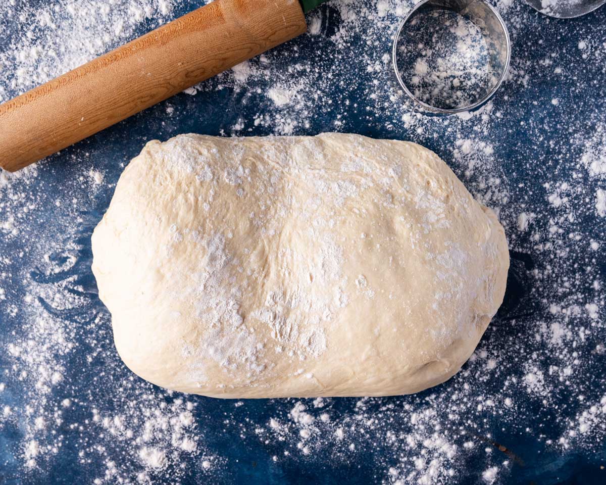 english muffin dough on lightly floured table