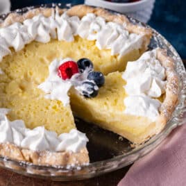 buttermilk pie in a pan with one slice missing