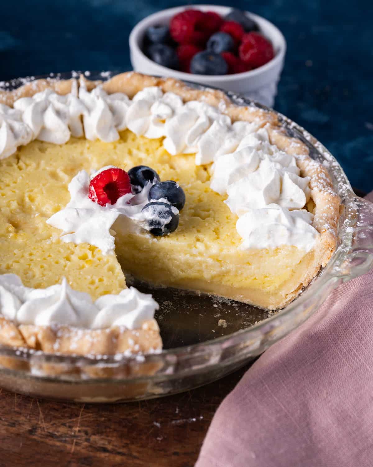 buttermilk pie in a pan with one slice missing