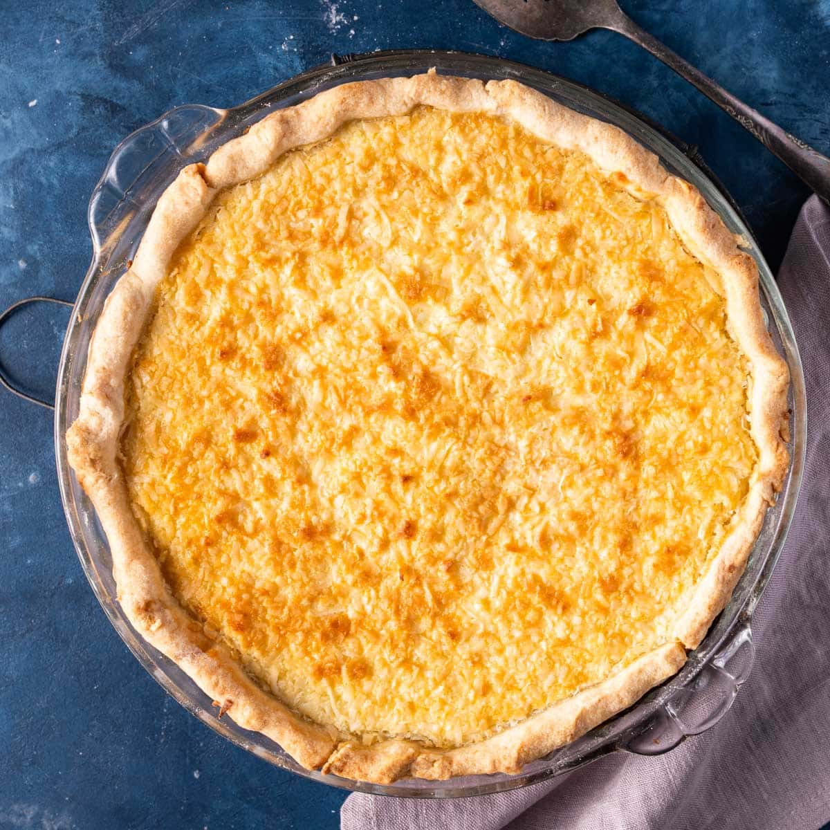 overhead view of a baked custard pie with coconut