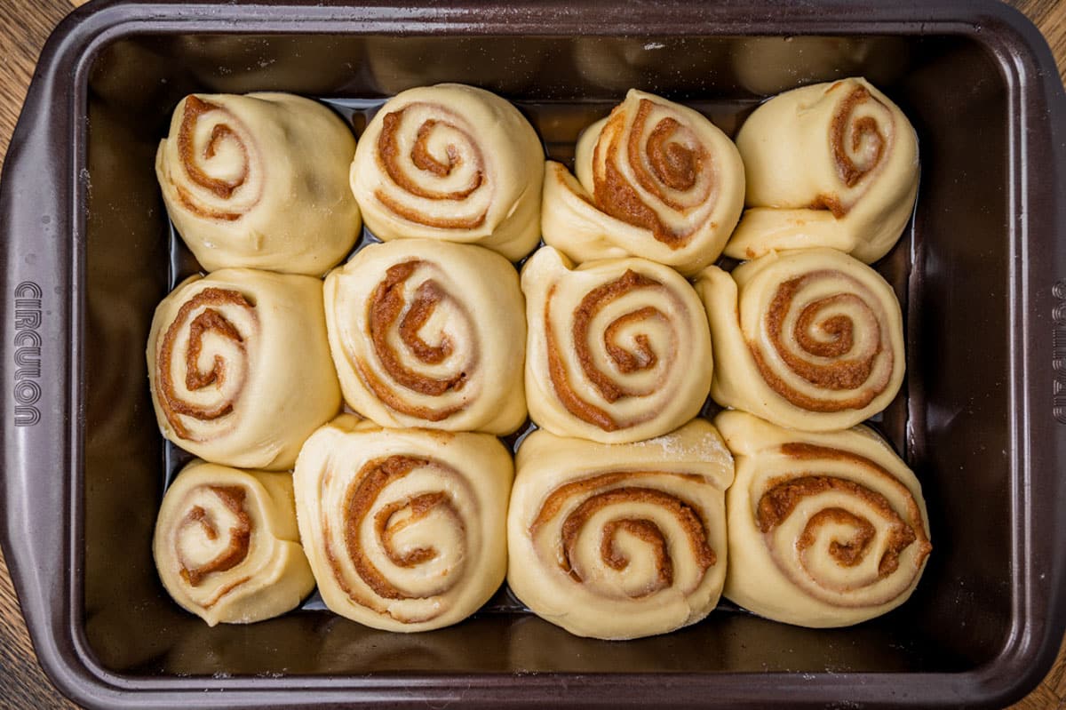 unbaked cinnamon rolls in a pan