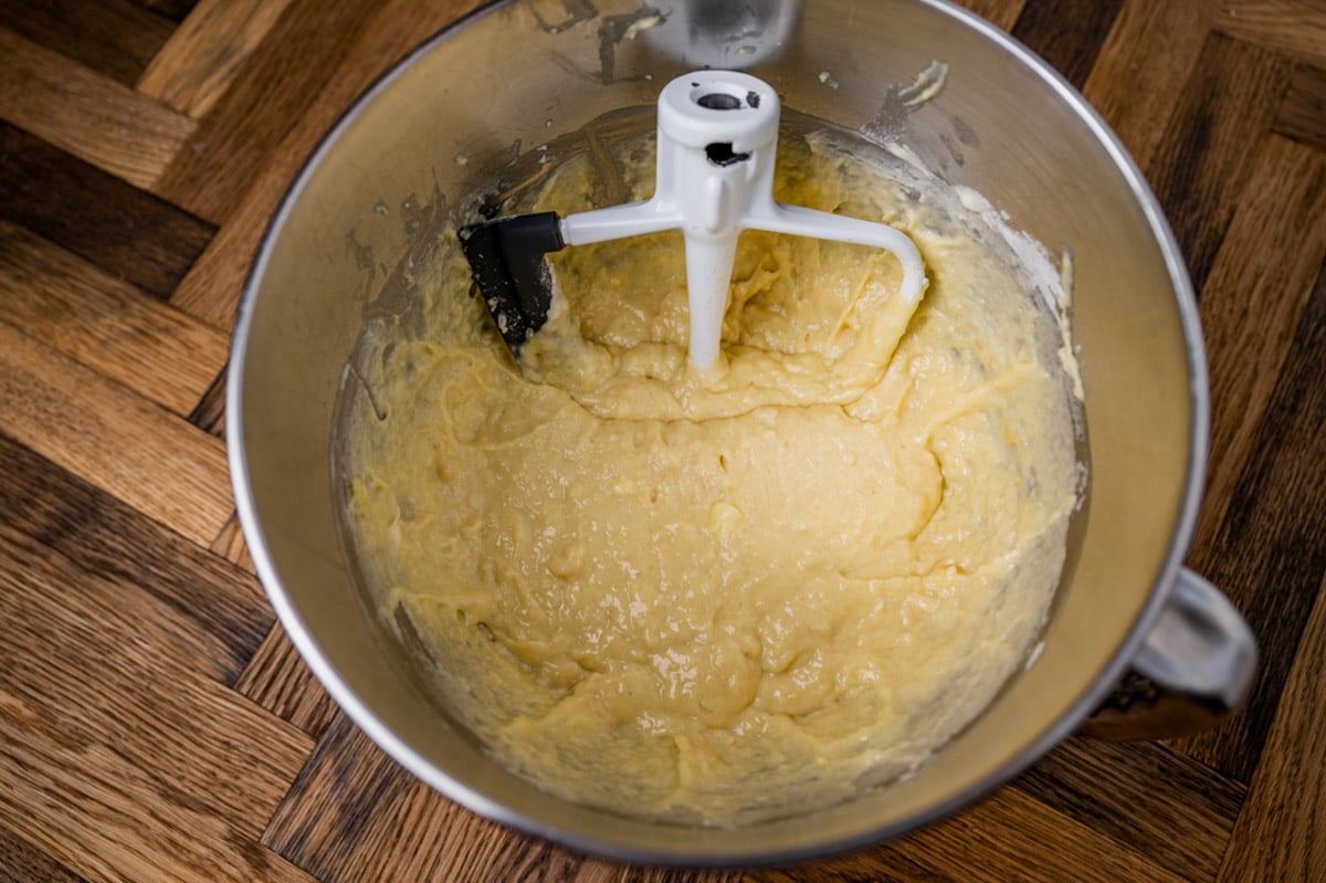 wet cinnamon roll dough in a mixing bowl